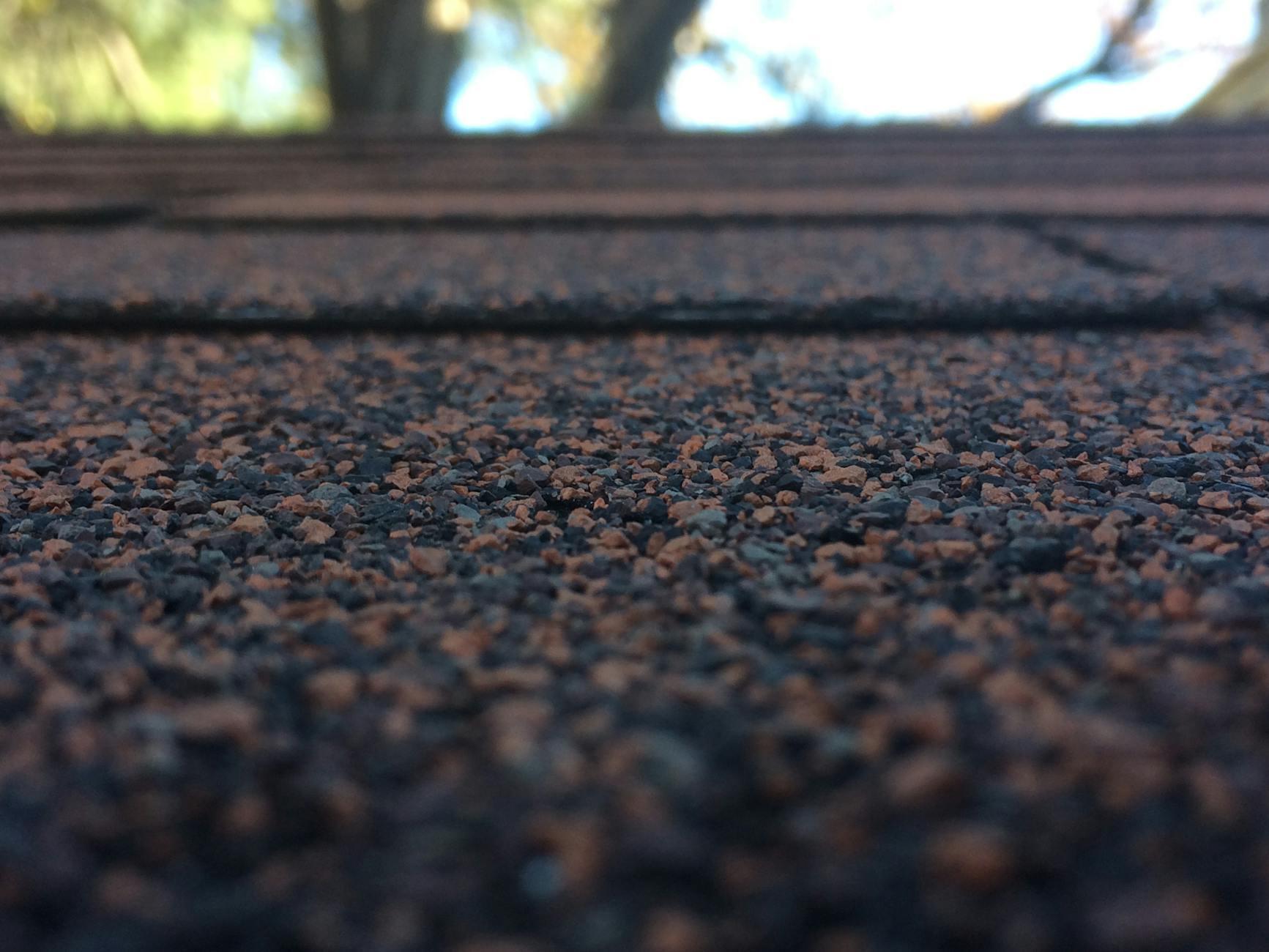 Hail damage on shingle close-up