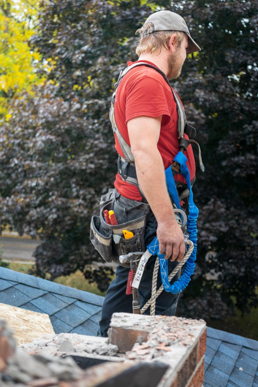Linecrew inspector walking a residential roof with clipboard